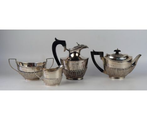 A matched bachelors three-piece tea service, various makers and dates, of oval outline with half reeded decoration, includes 