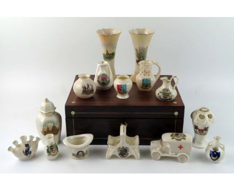 A small collection of crested china wares, including vases, hatpin holder, urns etc contained in a rosewood and mother-of-pea