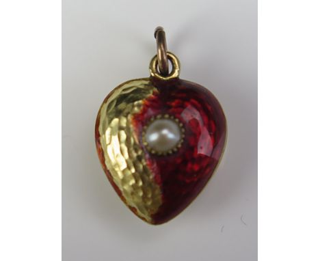 A Victorian Precious Yellow Metal Heart Shaped Memorial Pendant with enamel and untested pearl decoration and glazed panel to