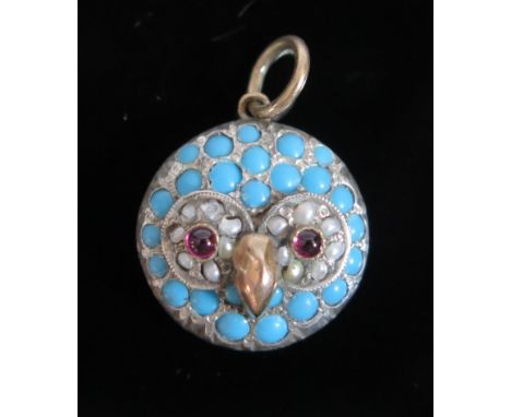 An Owl Pendant set with turquoise, pearl and cabochon pink stone in an unmarked precious yellow and white metal setting, c. 1