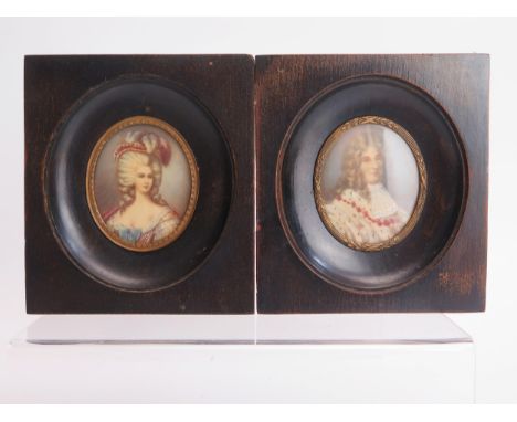 A Matched Pair of Portrait Miniatures _ one of Louis XIV with label verso indicating it is after Carriera and Marie Antoinett