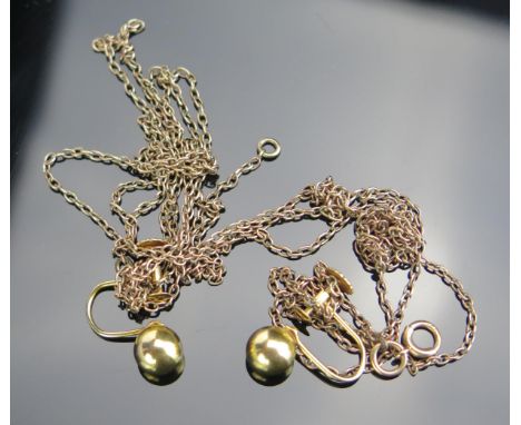 A Pair of 9ct Gold Studs (1.3g) and a long 9ct rose gold chain (4.6g). Knotted 