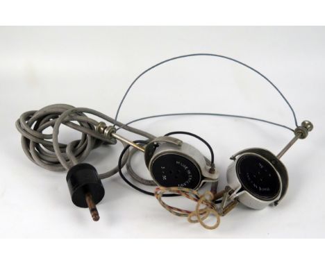 A pair of World war II period British army headphones, cable and plug. 