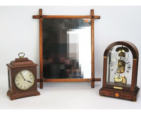 A reproduction four-glass mantel clock&nbsp; of arched outline, with 11cm silvered Roman dial, the single train movement stri