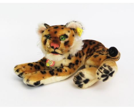 Steiff Vintage Recumbent Tiger 2317/1 - glass eyes, complete with yellow ear tag, button, chest tag and origin label (23cm) -