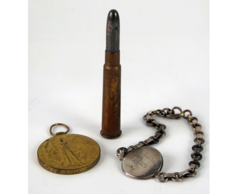 A World War I Victory Medal to 1887 Pte. L. Deering. Devon. R. a pencil in the form a .303 bullet, and a silver identity brac