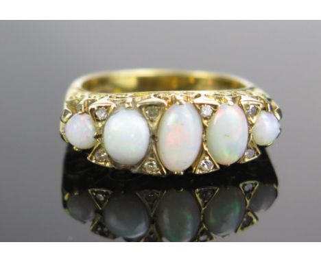 A 9ct Gold, Opal and Diamond Ring, c. 21mm long head, size K, 5g 