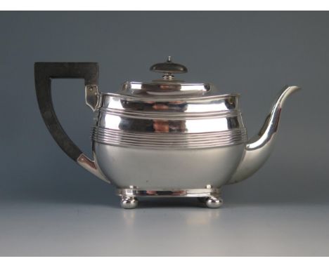 A George V silver barge-shaped teapot, maker Harrison Brothers &amp; Howson, Sheffield, 1925, with ribbed girdle, raised on s