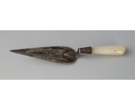 A silver book mark in the form of a trowel, with mother-of-pearl handle, 7cm long. 