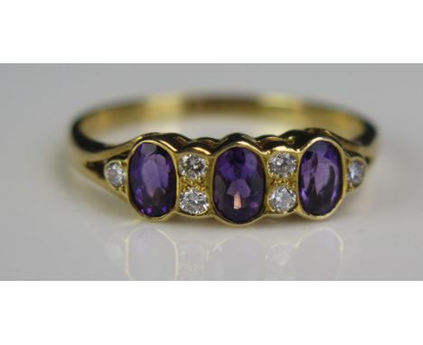 An 18ct Gold, Amethyst and Diamond Ring, size R.5, 2.9g 