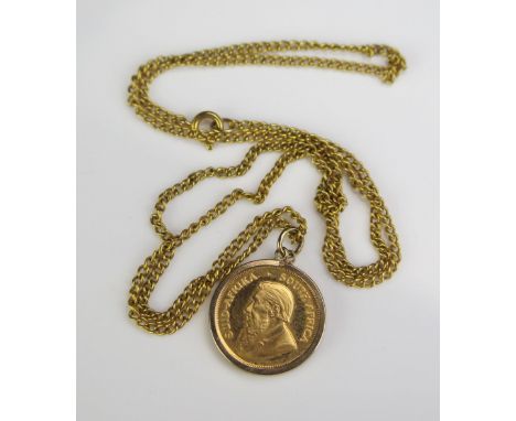 1/10th Oz. Gold Kruggerand in a 9ct gold mount and on a gold plated chain 