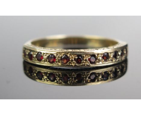 A 9ct Gold and Garnet Half Eternity Ring, size R, 2.4g 