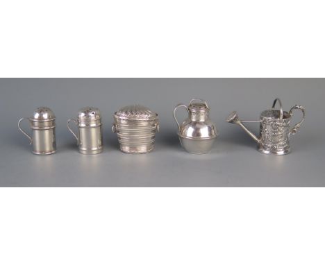 A pair of miniature silver pepperettes in the form of dredgers, a miniature silver watering can, a silver model of a wine coo
