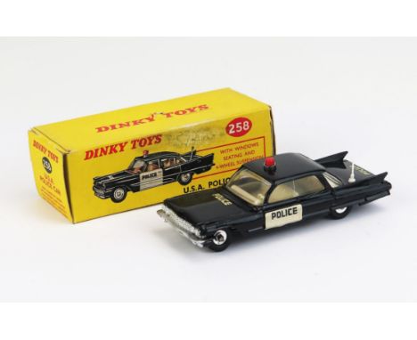 Dinky 258 Cadillac 62 USA Police Car - black, white doors, ivory white interior, solid red roof light, white aerial, spun hub