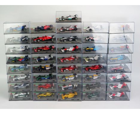 41 Panini F1 Model Racing Cars from the 1980's to 2010's, 1:43 Scale including Red Bull, Ferrari, Brabham, McLaren, Jordan, R