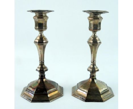 A pair of 20th century silver candlesticks, maker William Hutton &amp; Sons Ltd, Sheffield, date letters worn, with octagonal