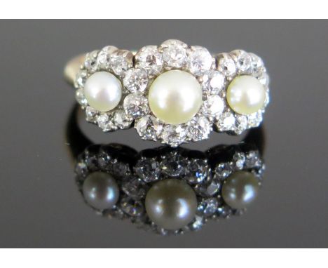 An Antique untested Pearl and Old Cut Diamond Ring in an unmarked high carat gold setting, 49mm central pearl with 2.2mm diam