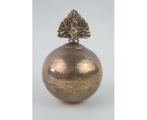 A Victorian white metal table cigar lighter in the form of a flaming grenade, inscribed and dated 1887, with screw top flamin