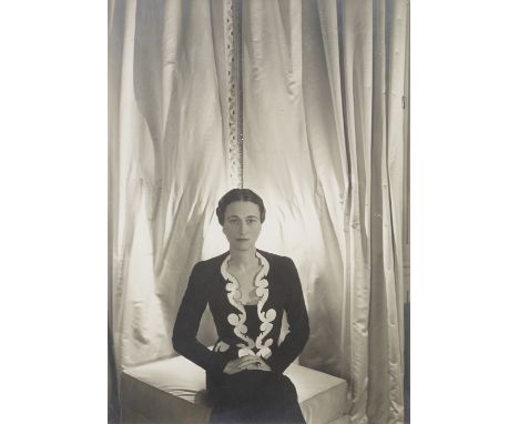 BEATON (CECIL)Wallis Simpson, Duchess of Windsor, seated wearing a dress and jacket designed by Elsa Shiaparelli,  bromide pr
