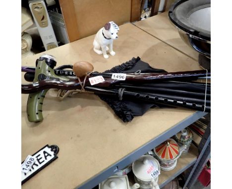 Collection of assorted walking sticks and an umbrella. Not available for in-house P&amp;P 