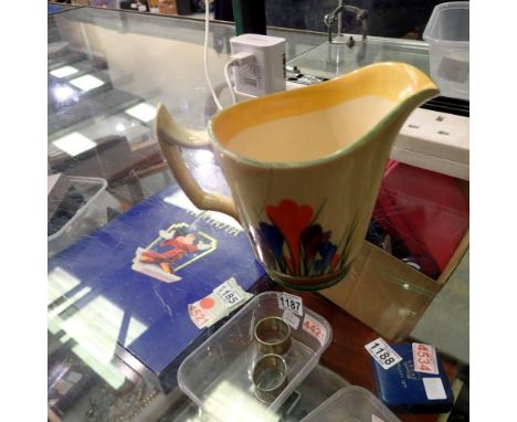 Clarice Cliff jug, with damages. UK P&amp;P Group 1 (£16+VAT for the first lot and £2+VAT for subsequent lots)
