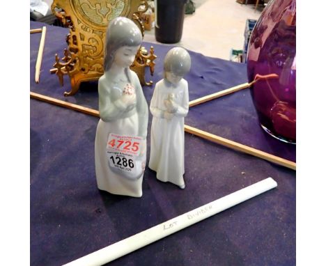 Two Nao figurines, largest H: 21 cm. UK P&amp;P Group 2 (£20+VAT for the first lot and £4+VAT for subsequent lots)