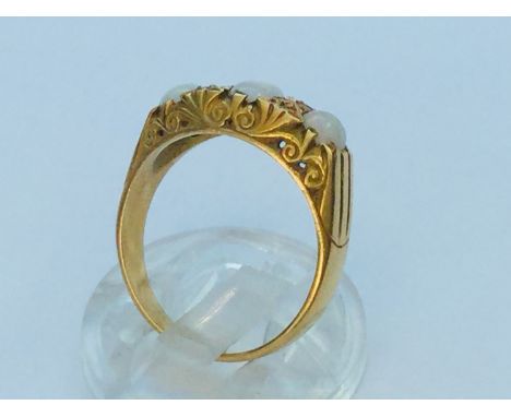 An 18ct yellow gold opal and diamond ring, set with 3 x oval opals and 4 x small diamonds in a gypsy style setting, ring weig