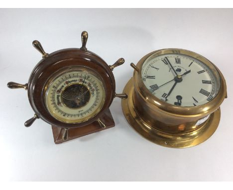 A brass bulkhead clock with 8-Day movement, the dial inscribed 'Made for Royal Navy,' 18cm diam, together with an aneroid bar