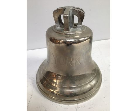 A large chrome plated brass maritime style bell, engraved with broad arrow and 'York', indistinct numbers imprinted on the ca