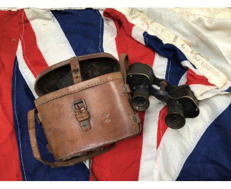 A large Naval ensign flag with broad arrow, approx. 250 x 125cm, together with a pair of binoculars by A. Kershaw &amp; Son, 