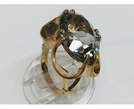 A 9ct yellow gold dress ring, set with a large oval stone possibly citrine measuring 14 x 20mm, weighs 7.4 grams, finger size