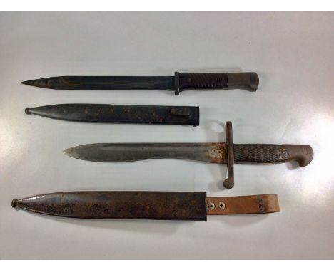 A Spanish M1941 Mauser Bayonet with fullered 'bolo' blade and metal scabbard, together with a Third Reich K98 Mauser bayonet 