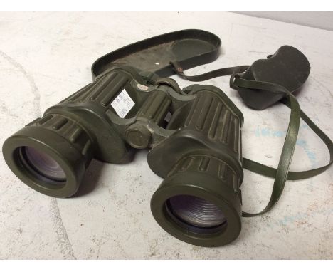 A pair of Tasco 311R model binoculars, 10x50mm, hard khaki green rubber finish with end caps, together with a stained beech f