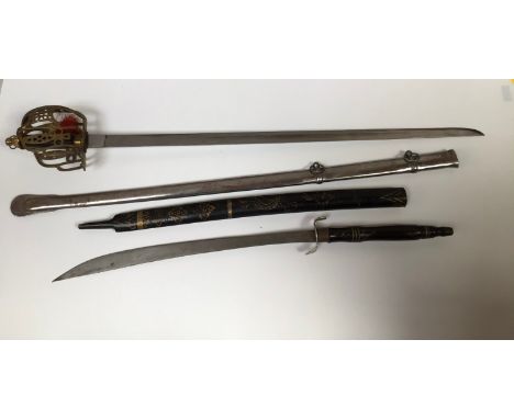 An 1828 pattern replica Scottish basket hilt, sword with plain blade, together with an Oriental sword with gold painted woode