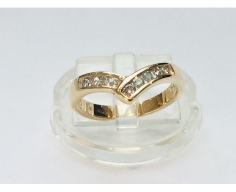 Addendum this is 9ct not 18ct.&nbsp; A 9ct yellow gold diamond 'wishbone' ring, set with 9 x round brilliant cut diamonds in 