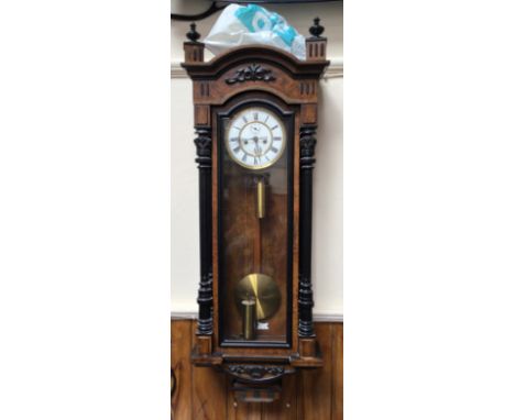 A large 19th century burr walnut and ebonised vienna wall clock, with domed top, white enamel and gilt dial with subsidiary s