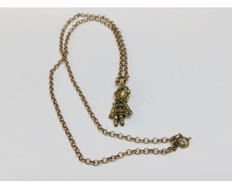 A 9ct gold articulated doll pendant suspended on a 9ct yellow gold belcher chain, measuring 20 inches and weighing a total of