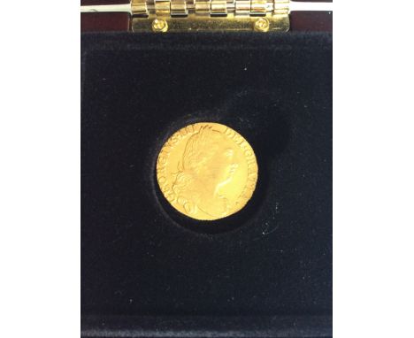 A George III Shield Guinea, 1777, 22ct gold, Obv. Fourth head, Rev. crowned shield, 8.36g, good definition, some scuffs to ki