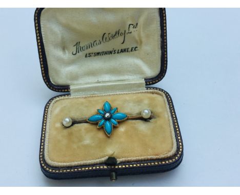 An unmarked gold turquoise diamond and pearl bar-brooch modelled as a flower, weighing 2.7 grams, in fitted box. 