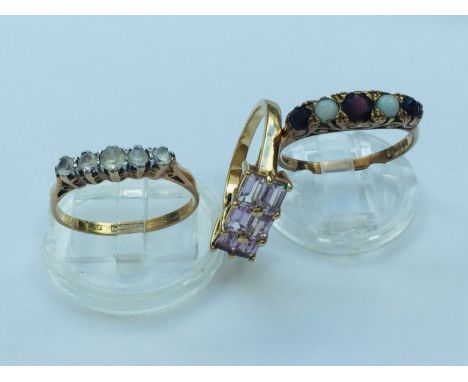 Three 9ct gold dress rings set with various coloured stones, total weight 7.7 grams