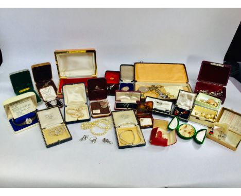 A selection of costume jewellery including various rolled gold lockets etc and brooches and rings and a WWII war and defence 