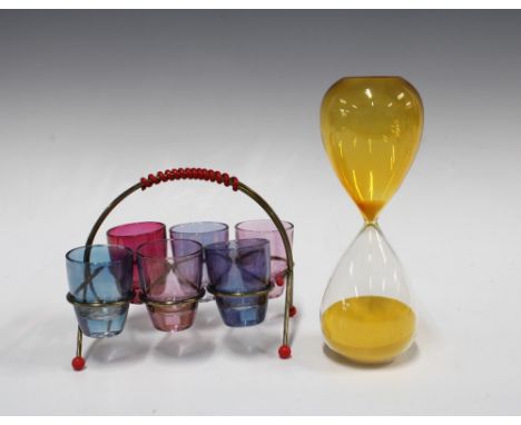 Hourglass sand timer with yellow and clear glass 20cm, together with a a vintage Atomic metal stand with six coloured glass s