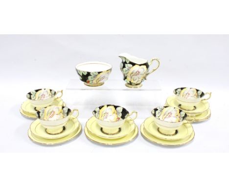 Art Deco Paragon fine bone china tea set, the cups with yellow flowers to a black ground, with pale yellow saucers and side p