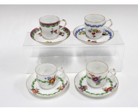 Four Meissen porcelain cups and saucers, fruit and flower garland patterns, blue crossed swords marks (8)