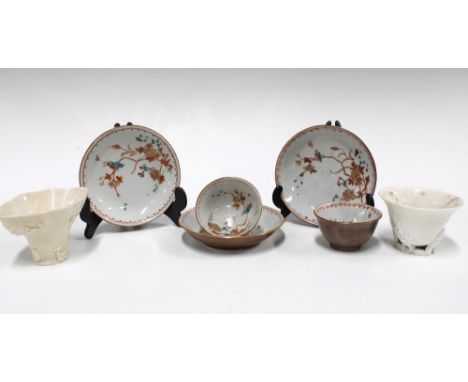 Two Chinese cafe au lait cups and three saucers, internally decorated with birds and flowers, one cup a/f, together with two 