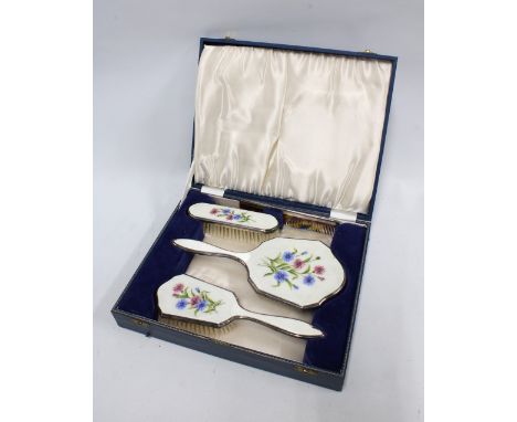 Early 20th century white metal and enamel backed dressing table brush set by Henry Clifford Davis, in fitted case