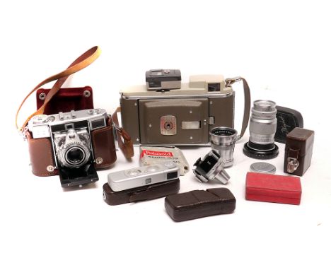 Cameras and Lenses: a Zeiss Contessa, a Minox B,  a Leica f/4 90mm Elmar, a Robot f/3.5 Tele-Xenar and other items (a lot)