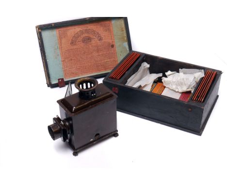 An Ernest Plank Tin Magic Lantern,  in maker;s box with slides (AF)