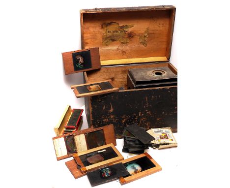 An Incomplete Tin Magic Lantern, together with various story and mahogany mounted slipper slides (a lot)