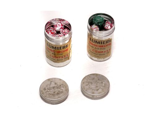 Compass Film: two tins msrked 'Film Lumiere' dated 1956 containing aparently unexposed films (a lot) 